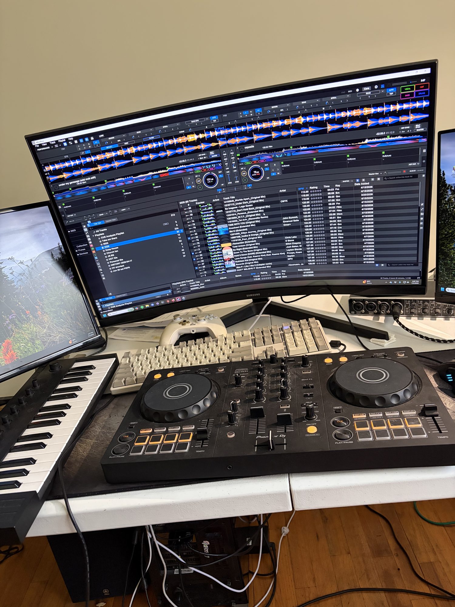 Home DJ setup: controller, monitor, and a MIDI keyboard