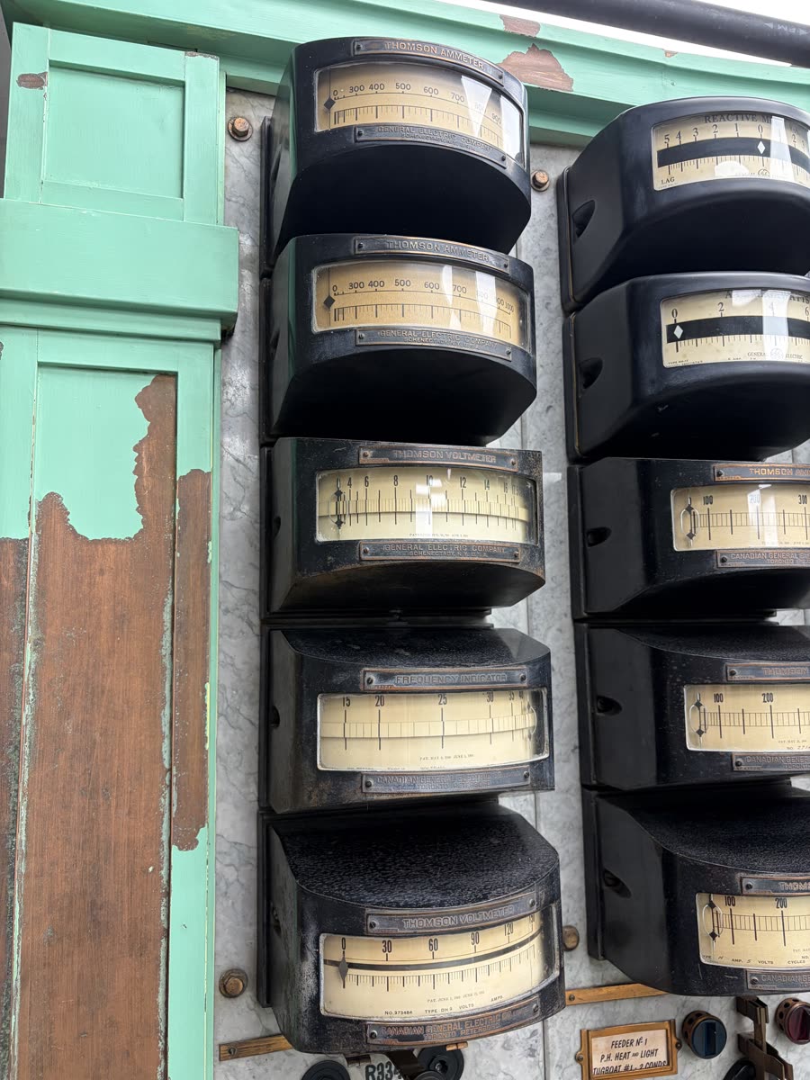 Row of antique Thomson ammeters and voltmeters