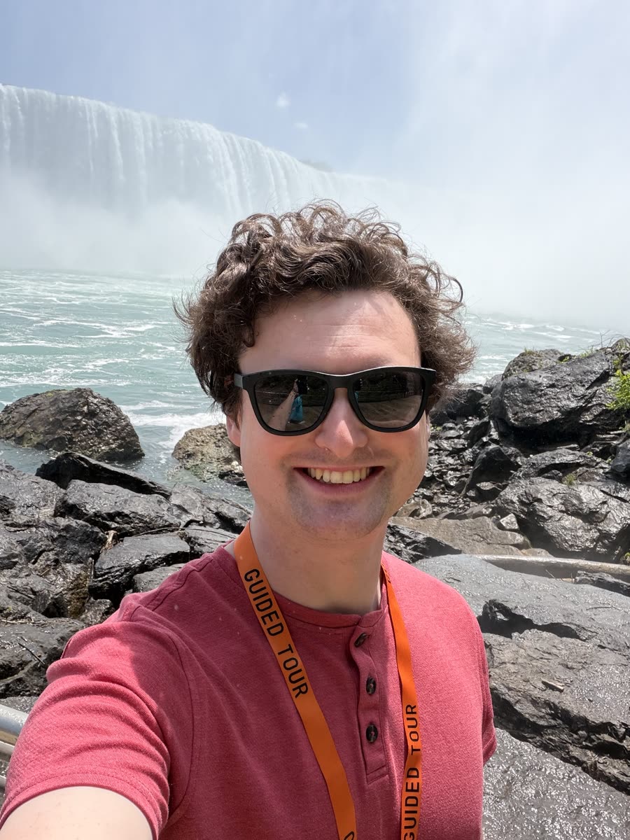 Selfie at Niagara Falls with a guided tour lanyard