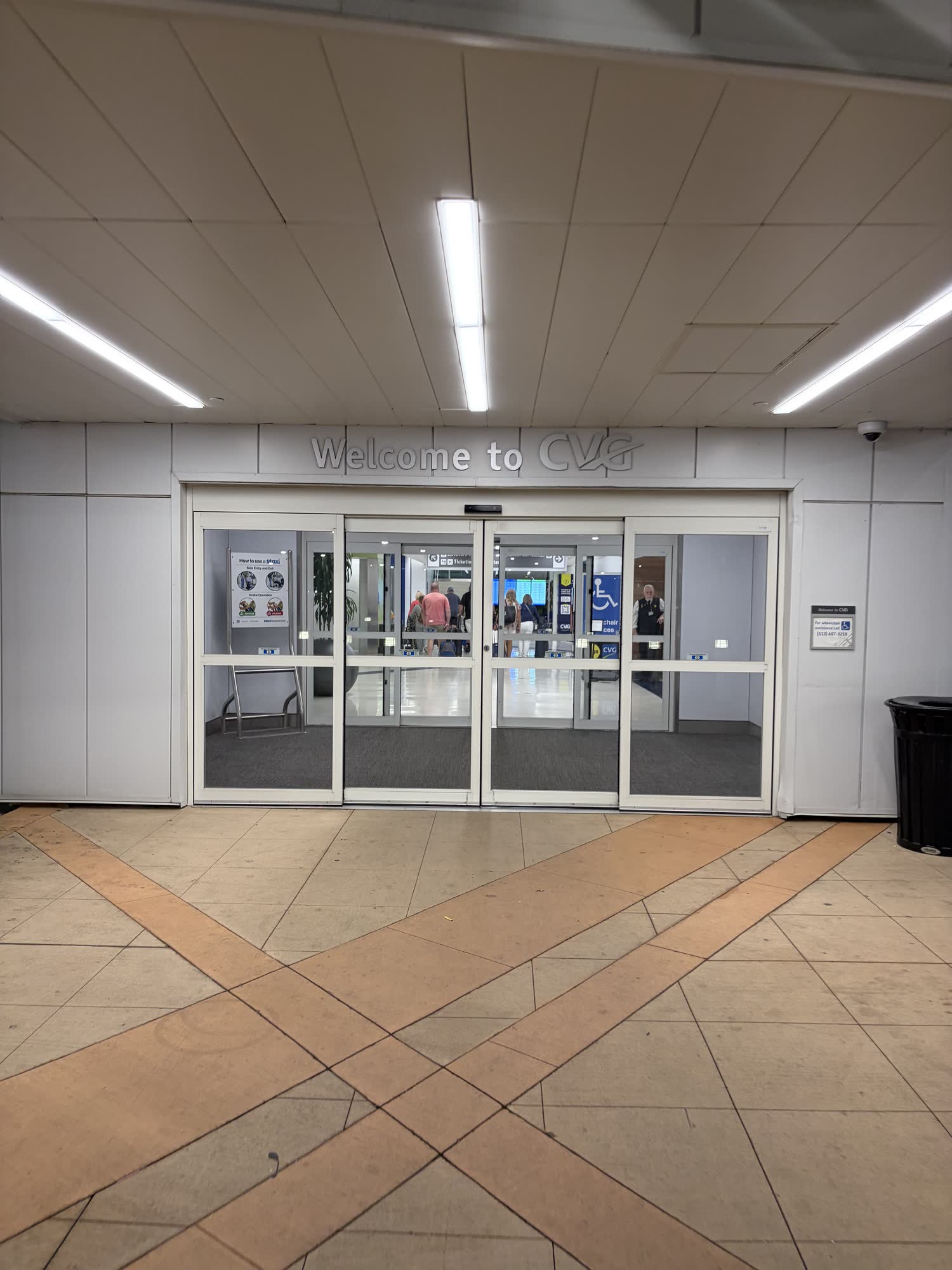 The Welcome to CVG sign over the terminal doors in Cincinnati, early morning